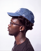 Washed navy ENZURA cap, side view showing the EZ monogram on the left panel
